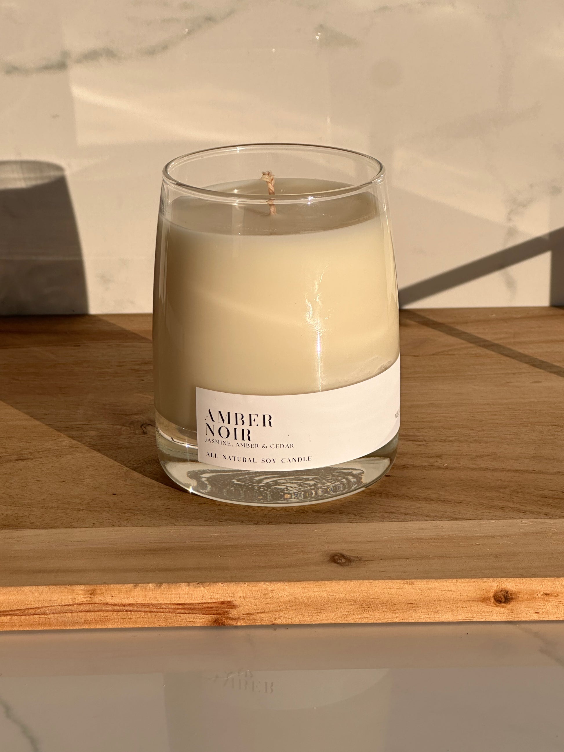 Amber Noir Soy Candle in a Clear Whiskey Glass Jar with White Label
