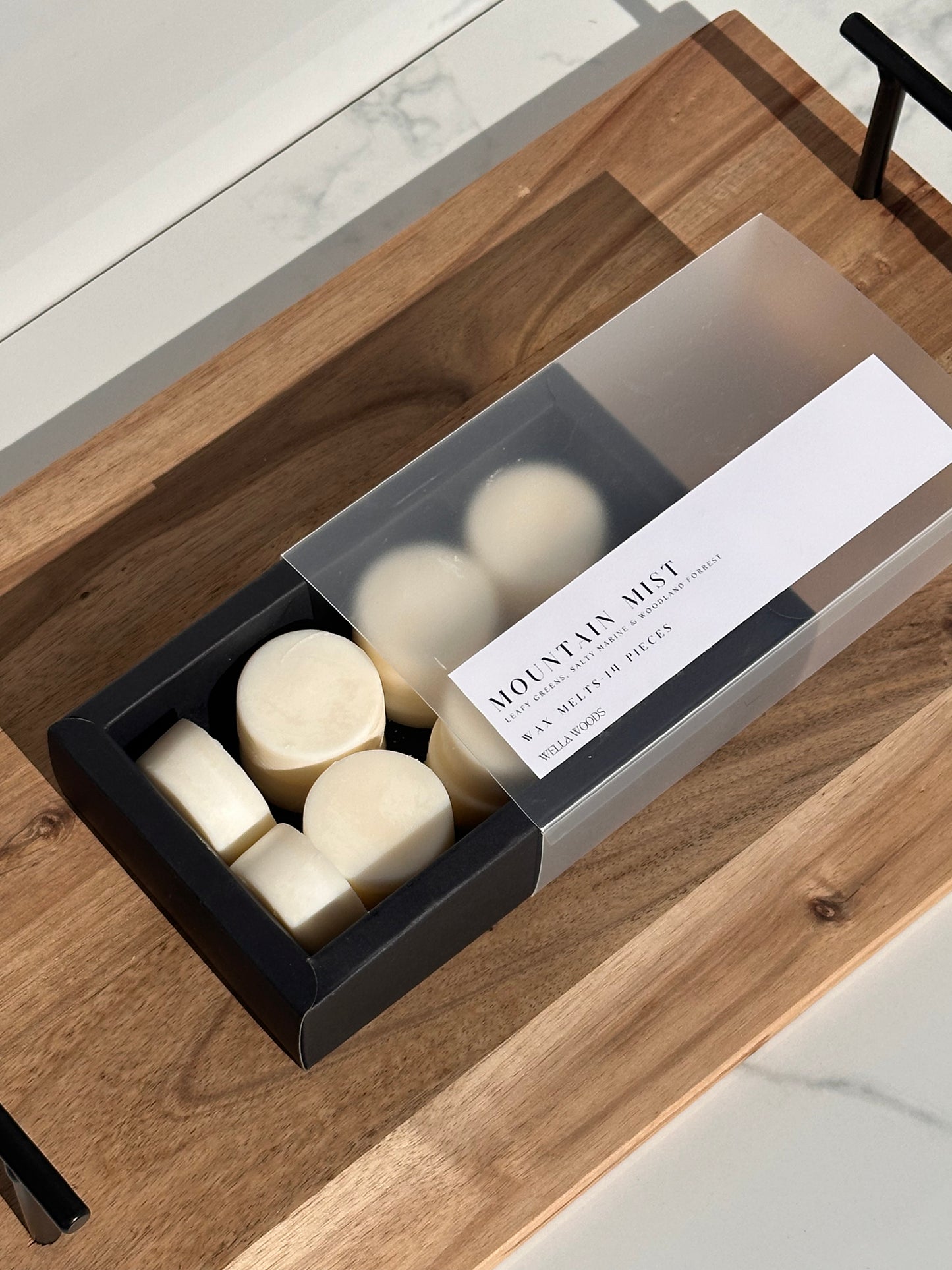 Mountain Mist Wax Melts in Black Cardboard box and transparent slider.